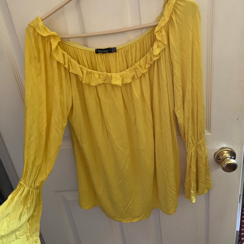Woman’s yellow off the shoulder top